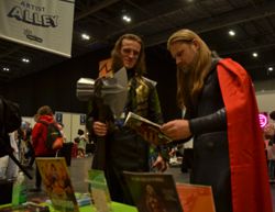 Thor and Loki checking The Apocalypse Girl Vol. Two - MCM London Comic - May 2022